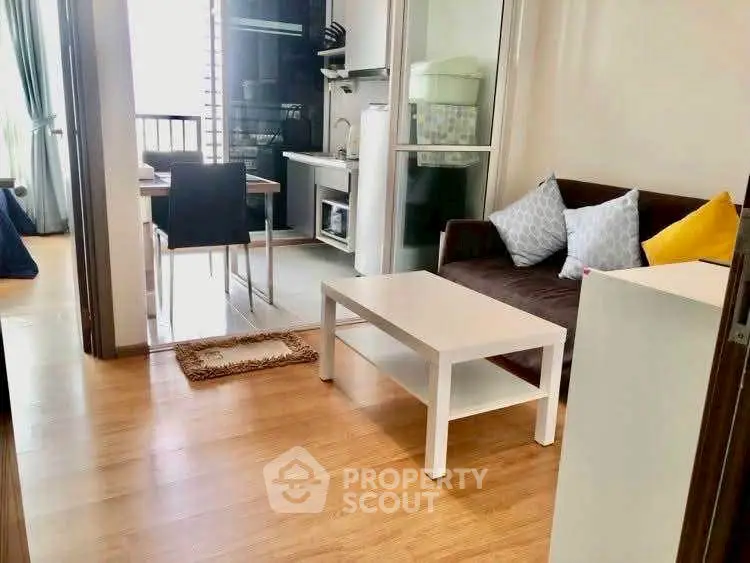 Cozy living room with modern kitchen in open layout apartment