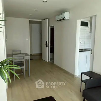 Modern apartment interior with open layout and sleek kitchen design