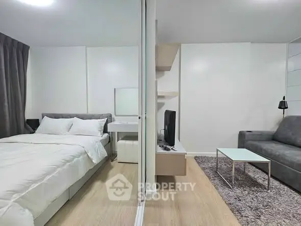 Modern studio apartment with cozy bedroom and stylish living area