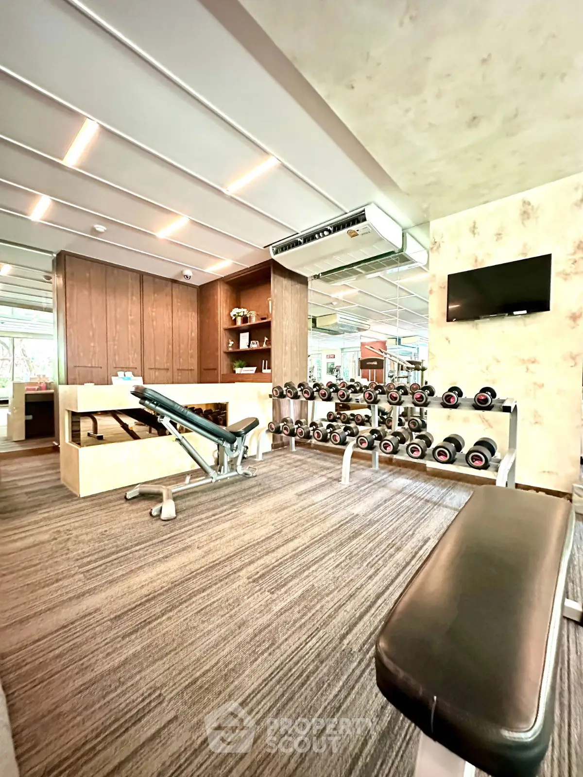 Modern gym with state-of-the-art equipment and stylish interior design.