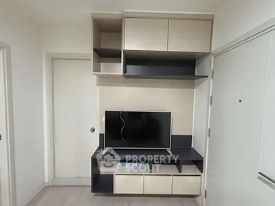 Modern living room with sleek TV unit and ample storage space