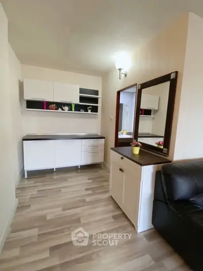 Charming living room with modern cabinetry and sleek flooring