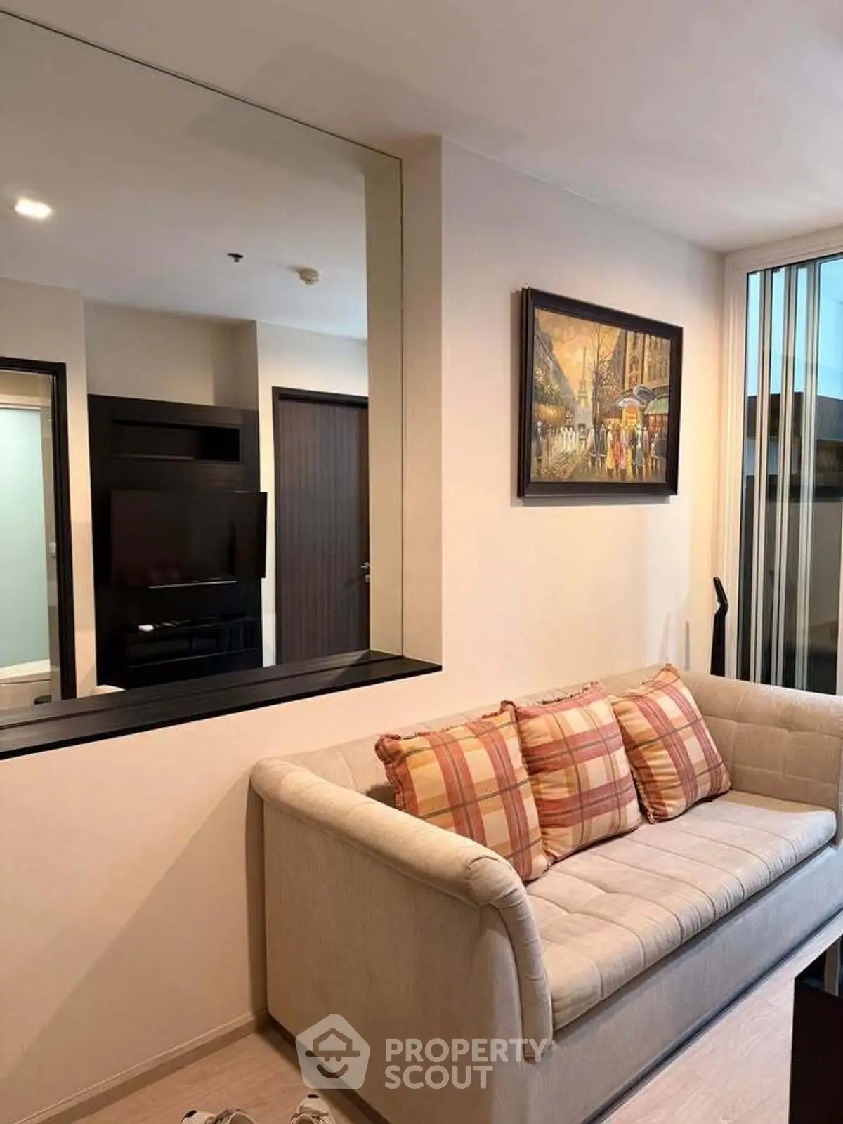 Cozy living room with plush sofa and modern decor, perfect for relaxation.