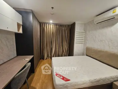 Spacious bedroom with modern furniture and elegant decor