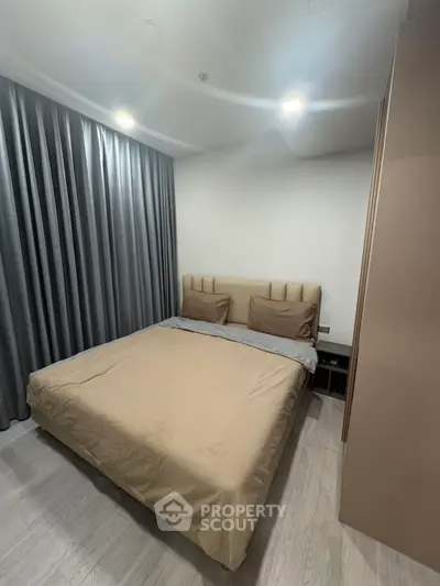 Cozy modern bedroom with elegant curtains and stylish bedding