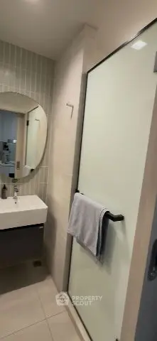 Modern bathroom with sleek shower and stylish vanity mirror