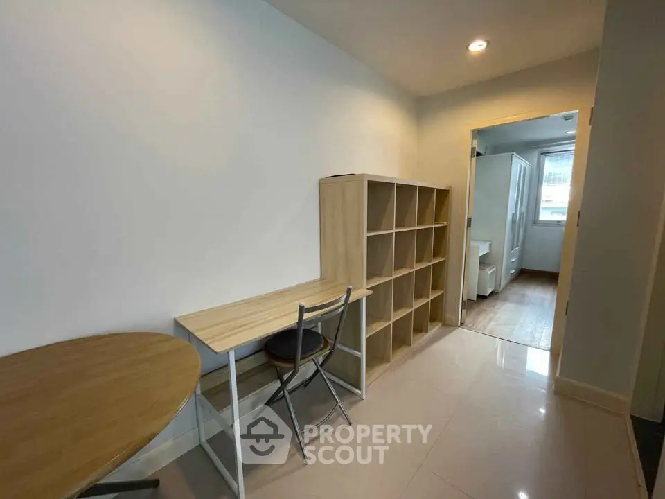 Modern study area with desk and shelving in a bright apartment