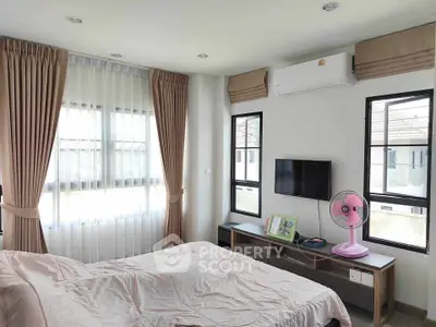 Bright and cozy bedroom with modern decor and natural light