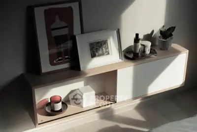 Stylish modern interior shelf with art and decor in cozy living space.
