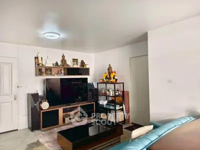 Cozy living room with modern entertainment center and stylish decor