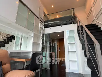 Modern loft apartment with mezzanine, sleek design, and ample storage space.