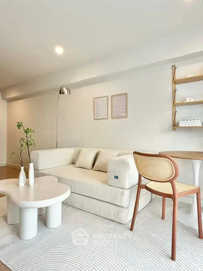 Modern minimalist living room with cozy beige sofa, stylish coffee table, and elegant decor.