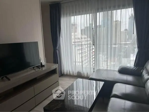 Modern living room with city view and sleek furniture