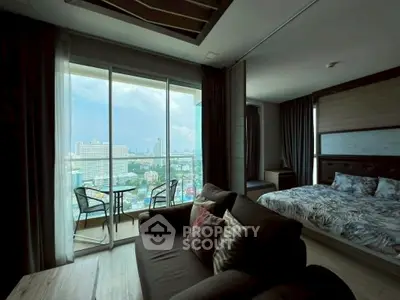 Luxurious condo with stunning city view from spacious living room and bedroom, featuring modern decor and balcony.