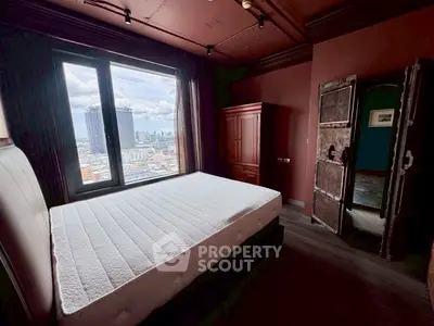 Luxurious bedroom with stunning city view and elegant wooden furniture.