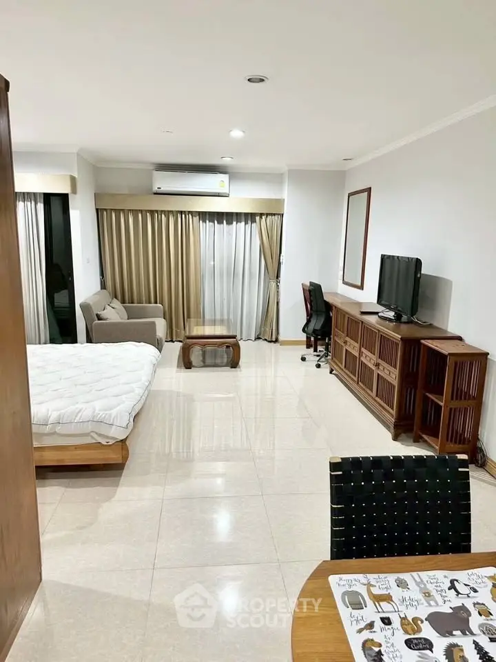 Spacious studio apartment with modern furnishings and natural light