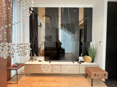 Stylish modern living room with elegant decor and large TV setup