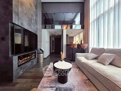 Luxurious modern living room with high ceilings, large windows, and elegant decor.