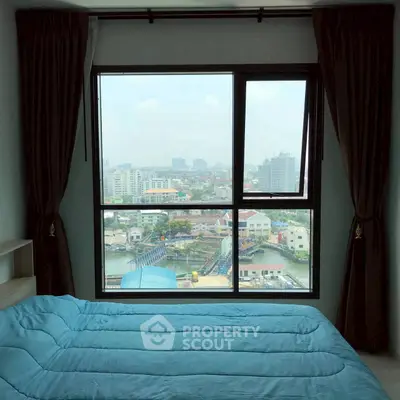 Cozy bedroom with stunning city view through large window