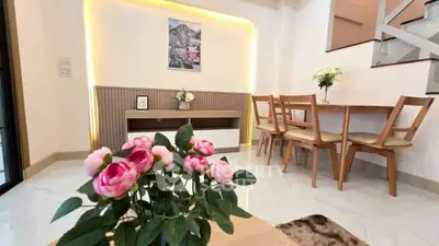 Elegant dining area with modern decor and stylish furniture in a bright, inviting space.