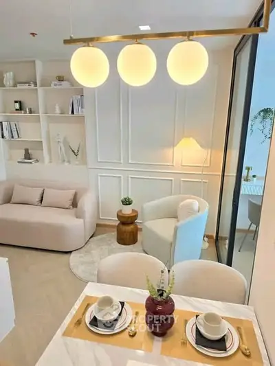 Elegant living room with modern decor and cozy seating area, perfect for relaxation and entertaining.