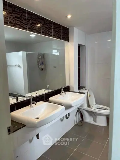 Modern bathroom with dual sinks and sleek design