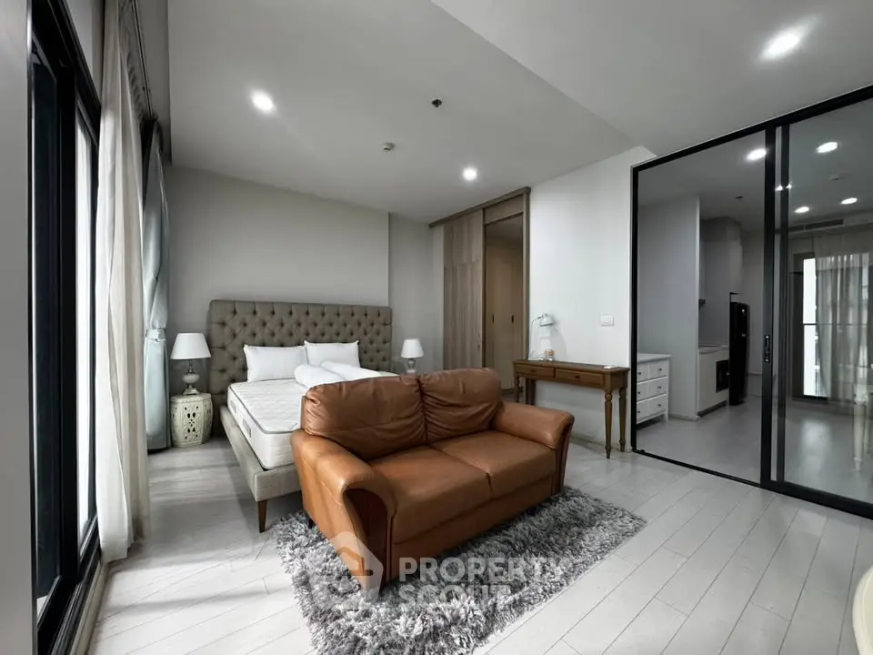 Luxurious bedroom with elegant decor and cozy seating area