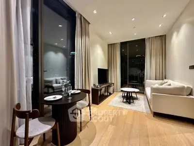 Modern living room with elegant decor and city view, featuring cozy seating and dining area.