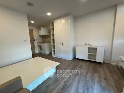 Modern studio apartment with sleek kitchen and stylish flooring