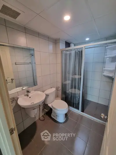 Modern bathroom with shower and sleek tile design