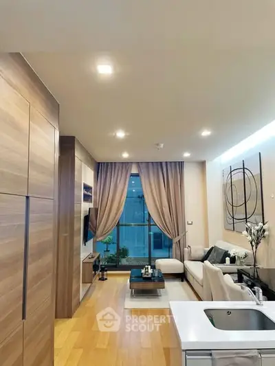 Modern living room with elegant decor and large window view