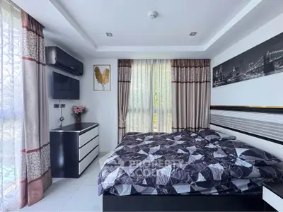 Modern bedroom with stylish decor and natural light
