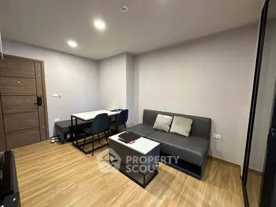 Modern living room with sleek furniture and wooden flooring