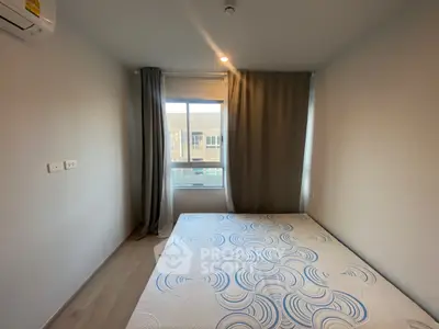 Cozy bedroom with natural light and modern decor in a stylish apartment.