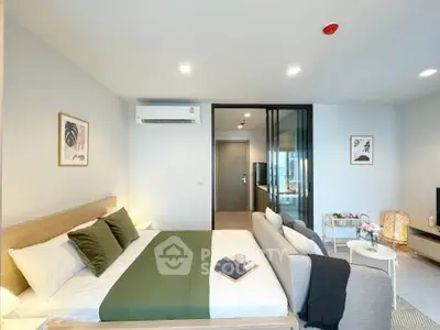 Modern bedroom with stylish decor and cozy ambiance in a contemporary apartment.