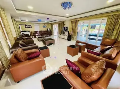 Spacious living room with luxurious seating and elegant decor