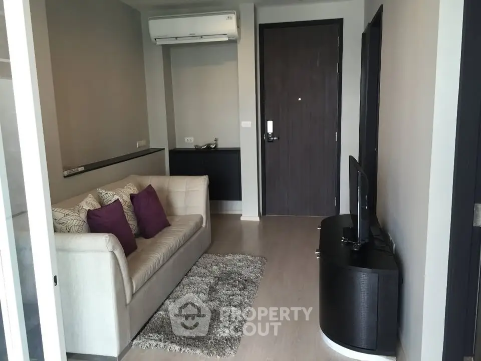 Modern living room with cozy sofa and sleek TV stand