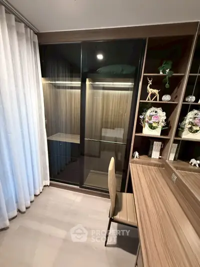 Elegant study room with wooden desk and glass cabinet, perfect for productivity.