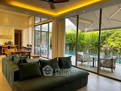Luxurious living room with pool view and modern open layout