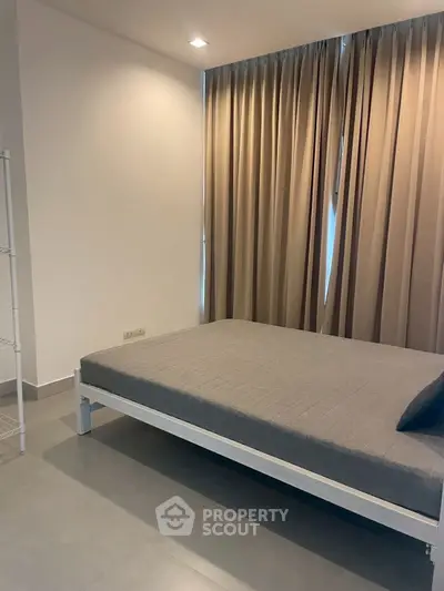 Modern minimalist bedroom with sleek design and neutral tones