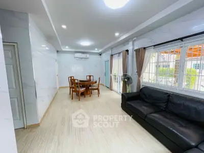 Spacious living room with modern decor and natural light