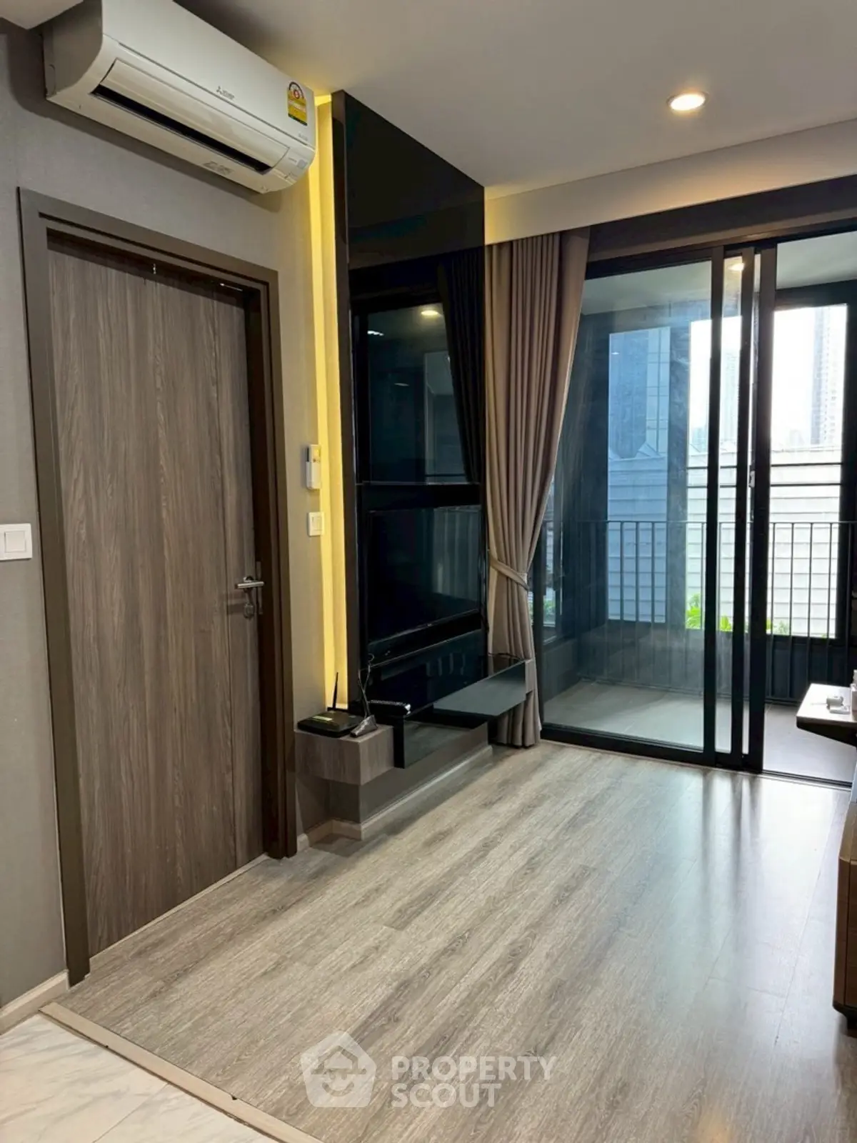 Modern living room with balcony view and air conditioning