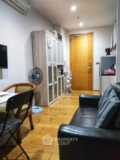 Cozy apartment living room with wooden flooring and modern furniture
