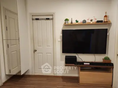 Modern living room with wall-mounted TV and stylish decor