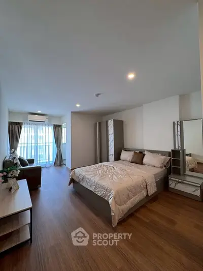 Spacious modern bedroom with elegant decor and natural light