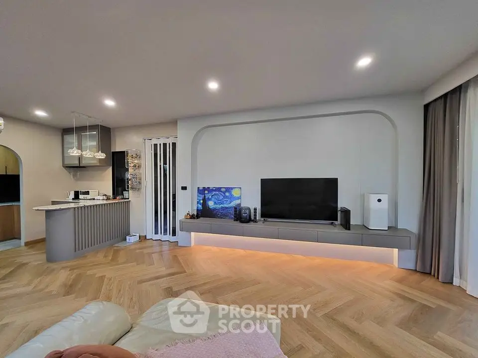 Modern living room with sleek design and ambient lighting