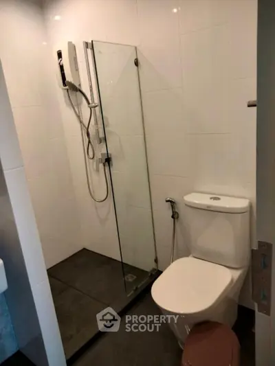 Modern bathroom with glass shower and sleek fixtures