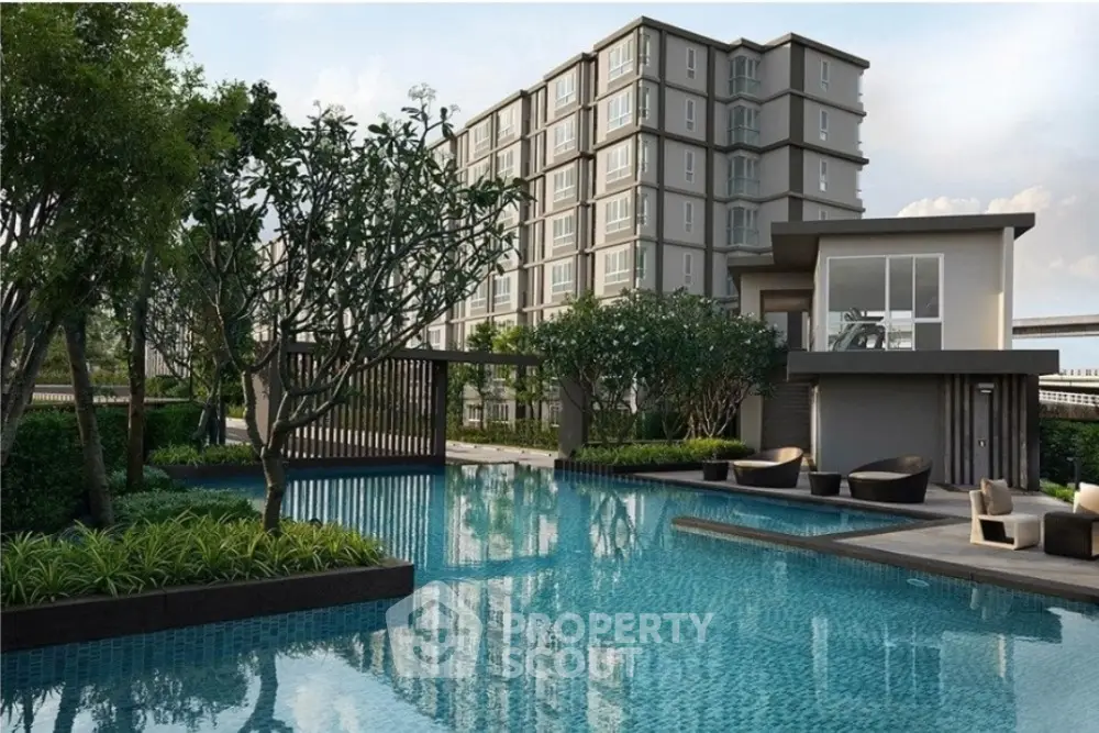 Luxurious modern apartment complex with serene pool and lush greenery.