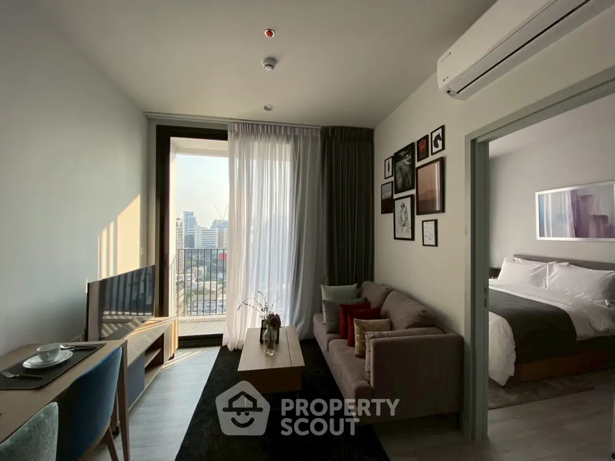 Modern living room with city view, stylish decor, and cozy ambiance.