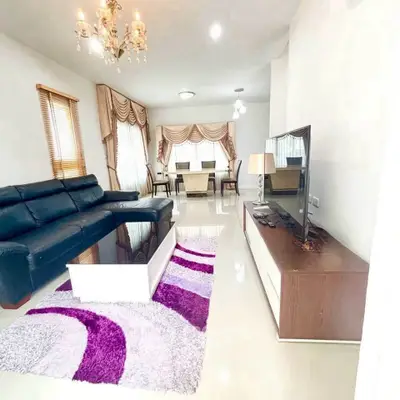 Spacious living room with elegant decor and modern furnishings in a bright, inviting space.